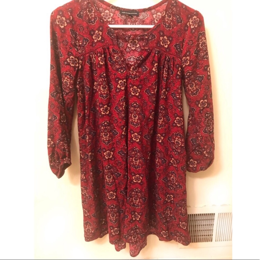 Flowing, paisley, burgundy above-the-knee dress.